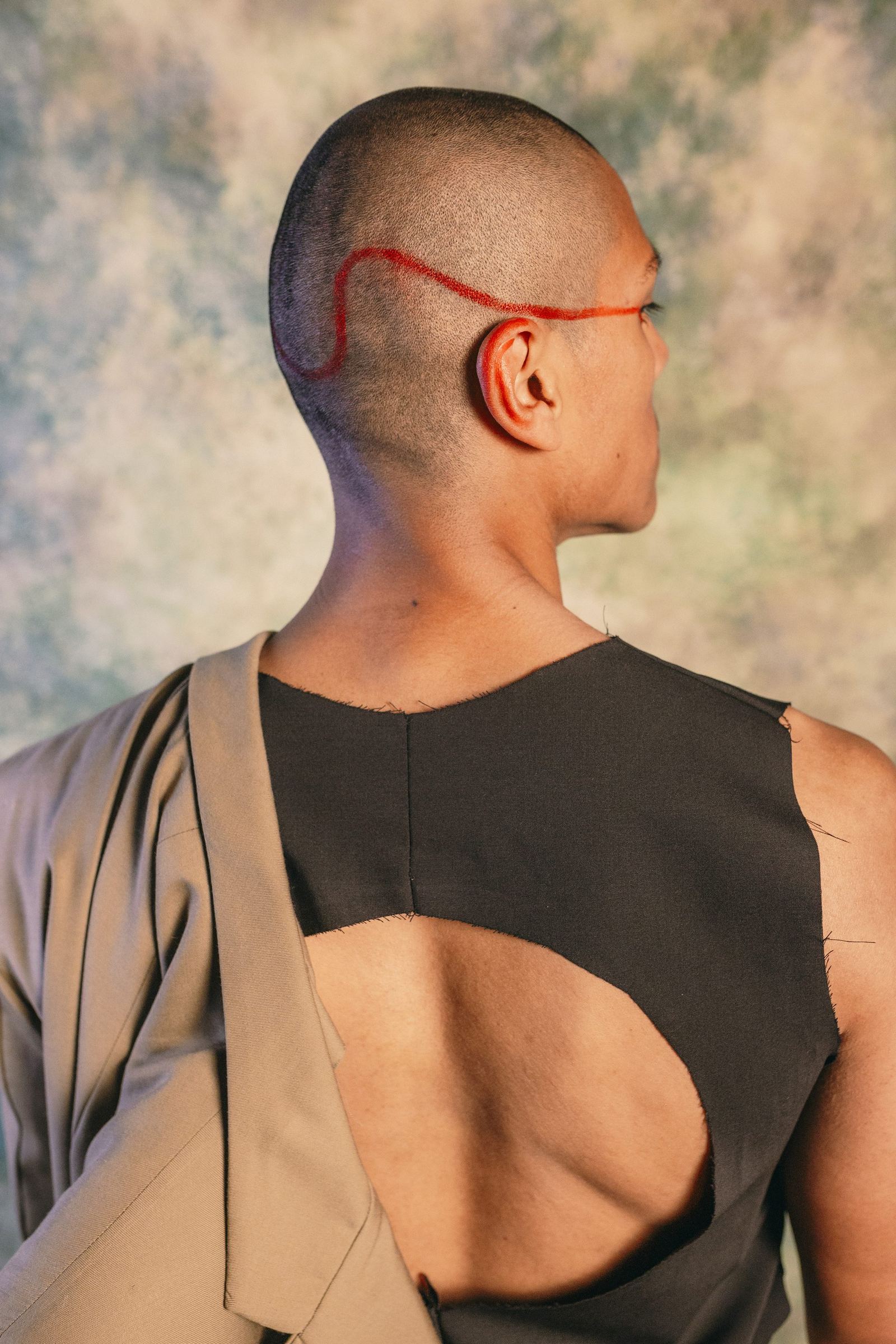 Lucia Bespoke portrait with moving drape and tailored silhouette expressing bespoke fluidity