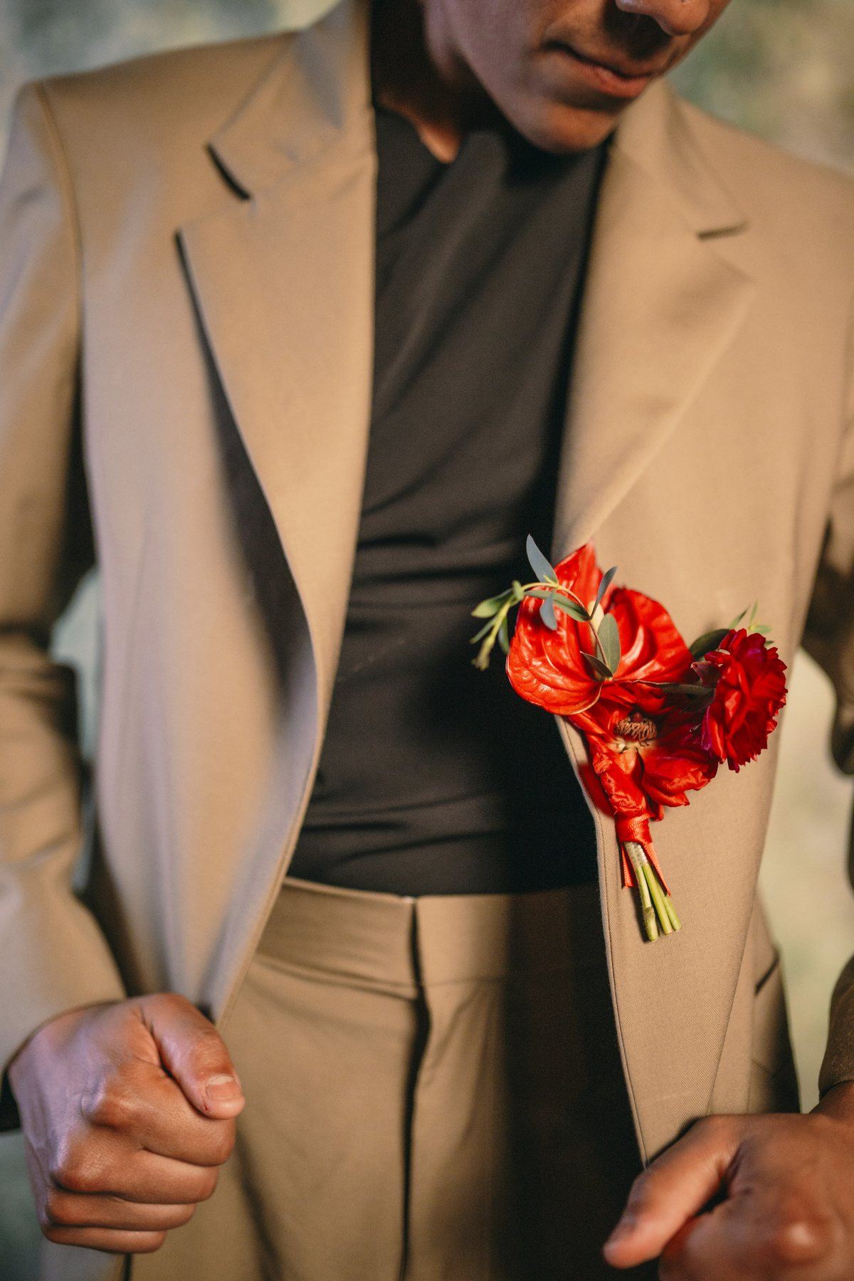 Close editorial tailoring detail with a sculptural silhouette