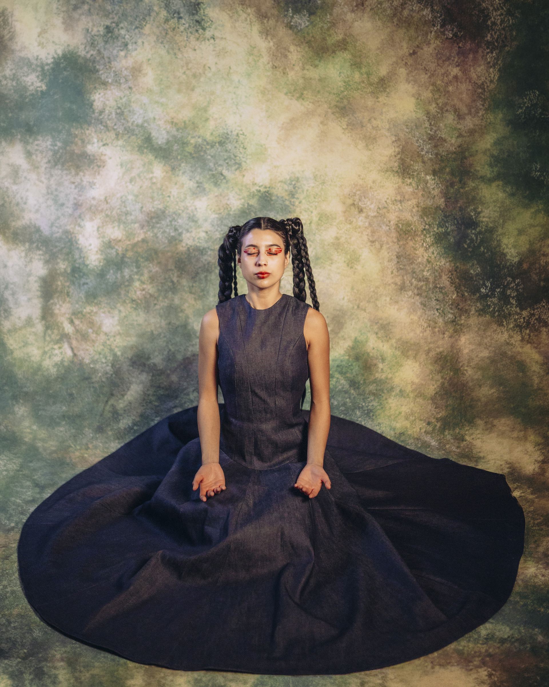 Tailoring process still with cloth and garment detail in a composed studio setting