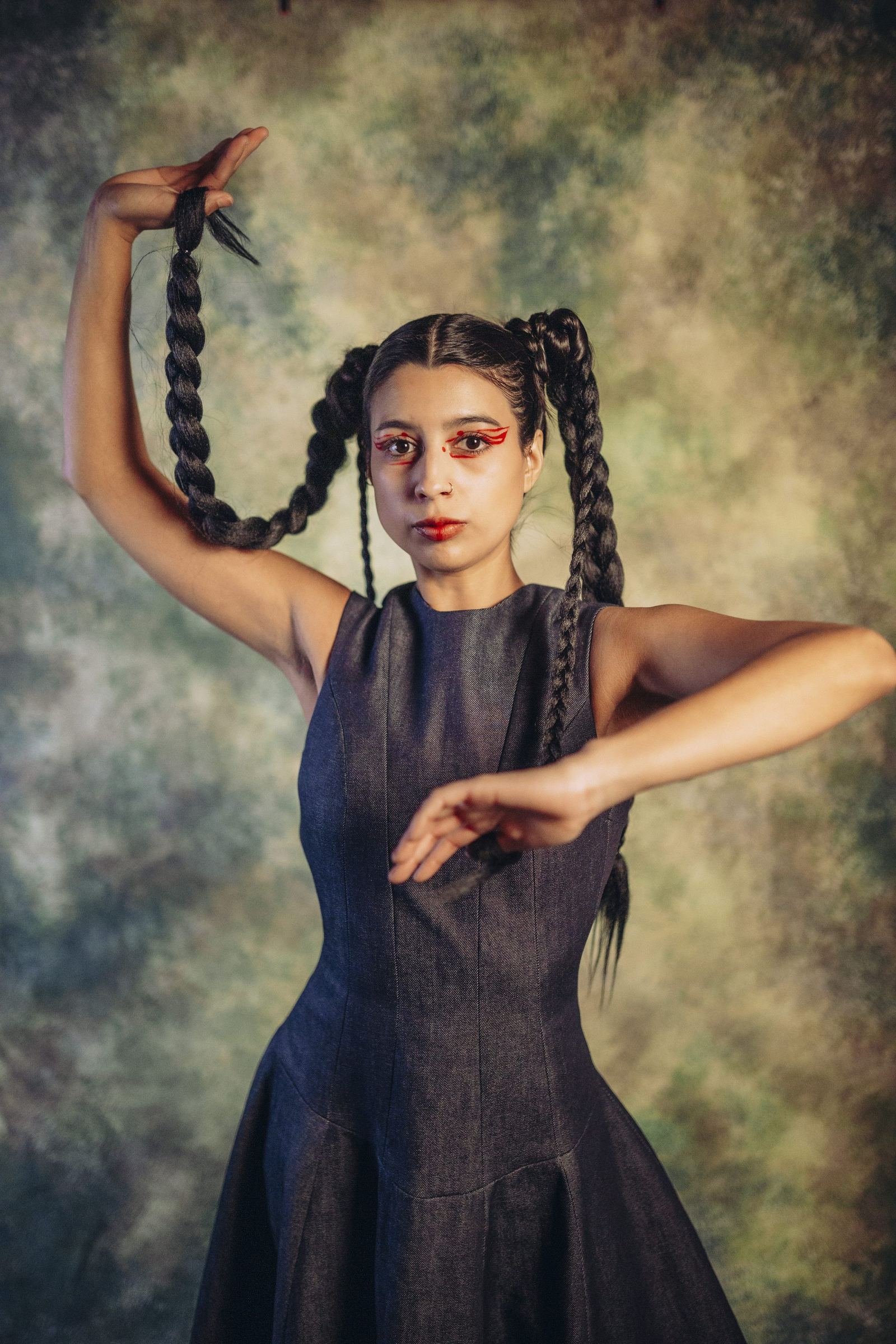 Sculptural Lucia Bespoke portrait with a poised seated silhouette and braided detail